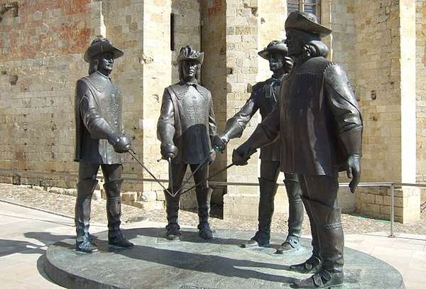 D’Artagnan an the three musketeers by Zurab Tsereteli, Condom (Gers), France Photo of a d’Artagnan and the three musketeers sculpture by Zurab Tsereteli in Condom (Gers), France.