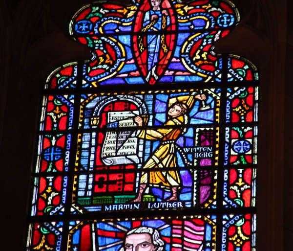 Martin Luther church window Washington D.C. Detail of a church window. Martin Luther nails his 95 theses to the church door in Wittenberg.