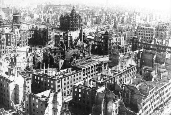 Black-and-white photograph of ruins of houses